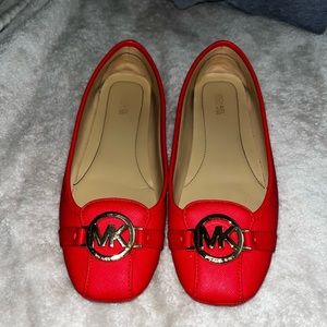Red Michael Kors size 9 red flats. Only worn once. Mint condition.